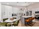 Modern kitchen with white cabinets, marble countertops, and a large island at 18825 N 34Th St, Phoenix, AZ 85050