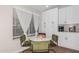 Kitchen breakfast nook with marble table and green velvet chairs at 18825 N 34Th St, Phoenix, AZ 85050