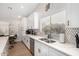 Modern kitchen with white cabinets, marble countertops, and gold accents at 18825 N 34Th St, Phoenix, AZ 85050