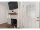 Living room with fireplace, mounted TV, and hardwood floors at 18825 N 34Th St, Phoenix, AZ 85050