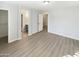 Bright bedroom with wood-look floors and spacious closet at 2014 N 94Th Gln, Phoenix, AZ 85037