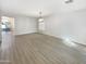 Bright dining room with hardwood floors and a chandelier at 2014 N 94Th Gln, Phoenix, AZ 85037