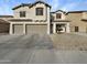 Two-story house with three-car garage and desert landscaping at 2014 N 94Th Gln, Phoenix, AZ 85037