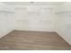 Large walk-in closet with ample shelving at 2014 N 94Th Gln, Phoenix, AZ 85037