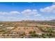 Aerial view of the ranch and surrounding landscape at 20334 E Colt Dr, Queen Creek, AZ 85142