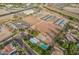 Aerial view of a large equestrian ranch with stables, riding arena, and RV park at 20334 E Colt Dr, Queen Creek, AZ 85142