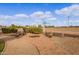 Relaxing patio with fire pit and seating area, perfect for outdoor entertaining at 20334 E Colt Dr, Queen Creek, AZ 85142