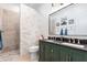 Modern bathroom with double vanity and a walk-in shower at 20334 E Colt Dr, Queen Creek, AZ 85142