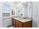 Bathroom with double sinks, granite countertop, and large mirror at 20334 E Colt Dr, Queen Creek, AZ 85142