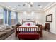 Main bedroom with plush carpet, king-size bed, and en-suite bathroom access at 20334 E Colt Dr, Queen Creek, AZ 85142