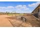 Riding arena with obstacles and covered stables at 20334 E Colt Dr, Queen Creek, AZ 85142