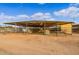 Rows of stables with covered areas for horses at 20334 E Colt Dr, Queen Creek, AZ 85142