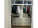 Large walk-in closet with ample shelving and drawers at 20334 E Colt Dr, Queen Creek, AZ 85142