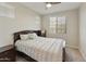 Spacious bedroom with double bed and window blinds at 20409 E Escalante Ct, Queen Creek, AZ 85142