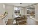 Bright dining room with a farmhouse table and access to the backyard at 20409 E Escalante Ct, Queen Creek, AZ 85142