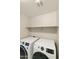 Laundry room with washer and dryer, and shelving at 20409 E Escalante Ct, Queen Creek, AZ 85142