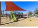 Community playground with shade structure and play equipment at 20409 E Escalante Ct, Queen Creek, AZ 85142