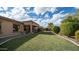 House exterior and grassy backyard at 2147 S Valle Verde Cir, Mesa, AZ 85209