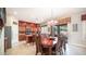 Bright dining room with a wood table and access to the kitchen at 2147 S Valle Verde Cir, Mesa, AZ 85209