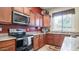 Granite countertops and stainless steel appliances in this kitchen at 2147 S Valle Verde Cir, Mesa, AZ 85209