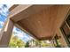 Covered patio detail, wood ceiling, and outdoor lighting at 2147 S Valle Verde Cir, Mesa, AZ 85209