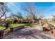 Beautiful backyard featuring a paved patio, landscaped greenery, and desert plants at 21804 N 38Th Pl, Phoenix, AZ 85050