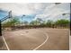 Outdoor basketball court with hoops, painted lines, and lighting for evening play at 21804 N 38Th Pl, Phoenix, AZ 85050