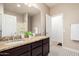 This full bathroom is complete with double sinks, granite counters and decorative tile flooring at 21804 N 38Th Pl, Phoenix, AZ 85050