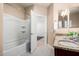 This bathroom features decorative tile flooring, granite counters and a shower over tub at 21804 N 38Th Pl, Phoenix, AZ 85050