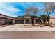 Lovely single-story home featuring a low maintenance yard with native desert landscaping and a two-car garage at 21804 N 38Th Pl, Phoenix, AZ 85050