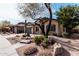 Charming single-story home with lush desert landscaping, a stone-accented entrance, and a two-car garage at 21804 N 38Th Pl, Phoenix, AZ 85050