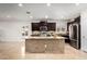 Modern kitchen featuring stainless steel appliances and center island with seating at 21804 N 38Th Pl, Phoenix, AZ 85050