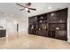 Open living area boasting dark built-in shelving and bright flooring at 21804 N 38Th Pl, Phoenix, AZ 85050