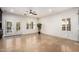 Spacious living room featuring shuttered windows and a ceiling fan at 21804 N 38Th Pl, Phoenix, AZ 85050