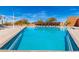 Stunning community pool offers a refreshing escape and features lounge seating and shaded cabanas at 21804 N 38Th Pl, Phoenix, AZ 85050