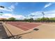 Well-maintained outdoor tennis courts with lighting for evening play at 21804 N 38Th Pl, Phoenix, AZ 85050