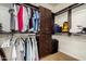 This walk-in closet offers ample storage with built in organizers, drawers, shelving and hanging rods at 21804 N 38Th Pl, Phoenix, AZ 85050