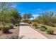 Picturesque neighborhood walking path lined with native plants offering an inviting space for strolls at 21804 N 38Th Pl, Phoenix, AZ 85050