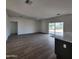 Bright living room with hardwood floors and access to the kitchen at 22216 W Skinner Rd, Wittmann, AZ 85361