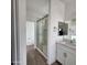 Modern bathroom with walk-in shower and white vanity at 22232 W Skinner Rd, Wittmann, AZ 85361