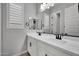 Clean bathroom with double vanity and modern fixtures at 22897 E Carriage Way, Queen Creek, AZ 85142