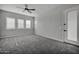 Well-lit bedroom with neutral decor and carpet flooring at 22897 E Carriage Way, Queen Creek, AZ 85142