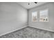 Simple bedroom with gray walls and carpet flooring at 22897 E Carriage Way, Queen Creek, AZ 85142