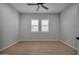 Bright bedroom with wood-look tile flooring and window shutters at 22897 E Carriage Way, Queen Creek, AZ 85142