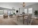 Elegant dining room with modern light fixture and ample natural light at 22897 E Carriage Way, Queen Creek, AZ 85142