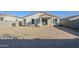 Large backyard with block wall and access from covered patio at 25565 W Gwen St, Buckeye, AZ 85326