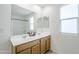 Double vanity bathroom with large mirror and shower/tub combo at 25565 W Gwen St, Buckeye, AZ 85326