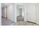 Bright and airy entryway with tile flooring and view into the living room at 25565 W Gwen St, Buckeye, AZ 85326