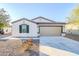 New single-story home with two-car garage and landscaped front yard at 25565 W Gwen St, Buckeye, AZ 85326