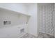 Laundry room with shelving and patterned wall at 25565 W Gwen St, Buckeye, AZ 85326